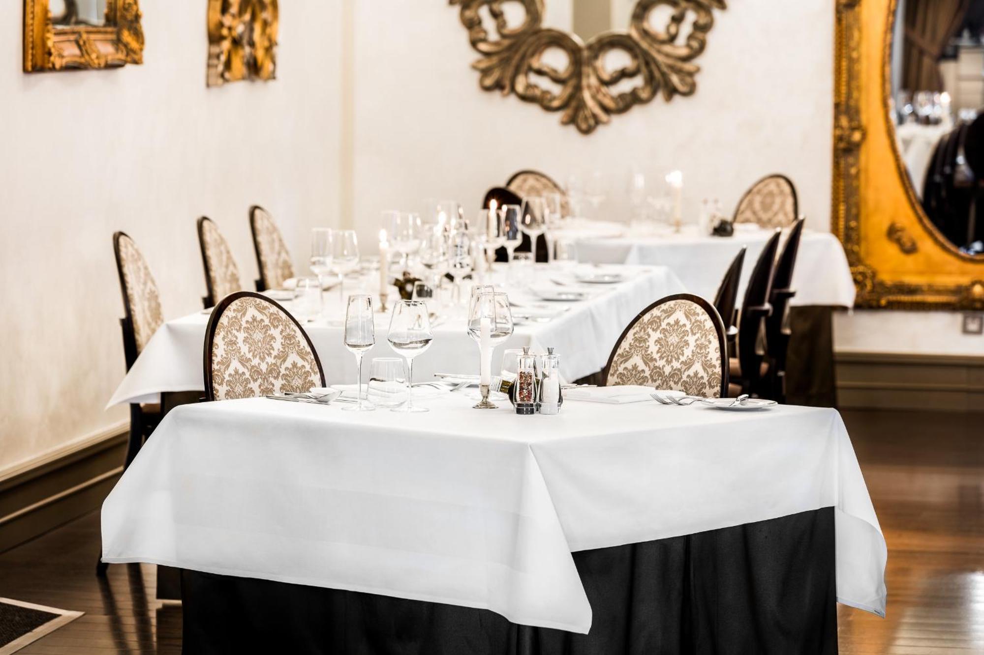 Grand Palace Brno Bagian luar foto A table set for a formal dinner